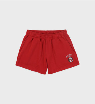 The Beverly Hills Crest Soft Disco Short - Ruby features an elastic waistband for comfort and a white Beverly logo on the left leg, set against a vibrant red background.