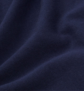 Close-up of navy fabric with soft texture and gentle folds, echoing the craftsmanship in the Beverly Hills Crest Soft Crewneck - Navy/White.