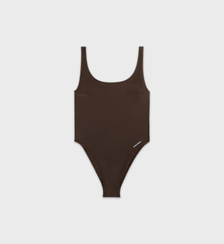 The Carla One Piece - Chocolate is a brown, sleeveless swimsuit made from ECONYL® regenerated Nylon with a scoop neck, showcased on a white background.