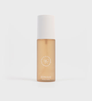 The Multi-Vitamin Face Mist, offering antioxidant protection, is packaged in a frosted bottle with a white cap and features crisp white text against a light background.