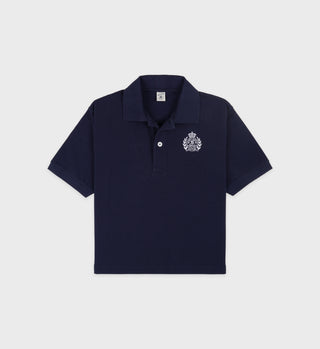 The H&W Crest Pique Polo in navy features a white embroidered logo on the left chest, displayed flat against a white background.