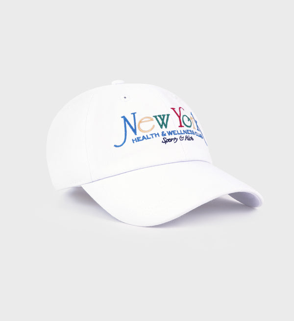 half side view of white baseball cap with multi-colored 'New York Health & Wellness Club Sporty & Rich' text embroidered on the front, featuring a curved brim.