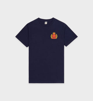 NY Crest T-Shirt - Navy/Gold: Navy blue tee featuring a small red and yellow crest emblem on the left chest, made from USA-grown cotton.