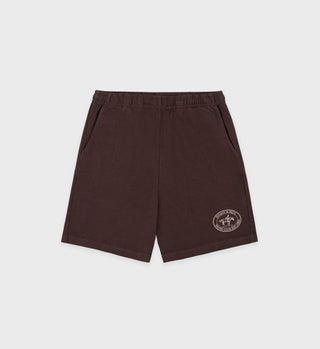 The Riding Club Gym Short in Chocolate/Cream is made in the USA, featuring an elastic waistband, side pockets, and a circular logo on the left leg for dependable quality.