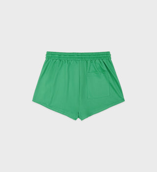The Serif Logo Roller Short - Verde/White features green fabric, an elastic waistband, a back pocket, and a discreet embroidered logo—shown on a white background.