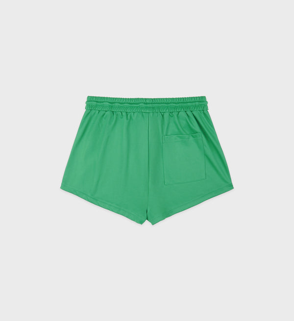 The Serif Logo Roller Short - Verde/White features green fabric, an elastic waistband, a back pocket, and a discreet embroidered logo—shown on a white background.