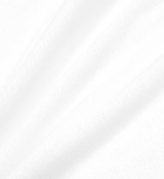 Close-up of three overlapping white tissue sheets with soft shadows and smooth texture, echoing the softness of the Prince Sporty Terry Short - White/Lapis, made from 100% cotton terry in Portugal.