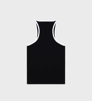 Back of black ribbed tank top with white contrast trim at the neckline and armholes, featuring a small circular embroidered logo on the chest, laid back on gray background.