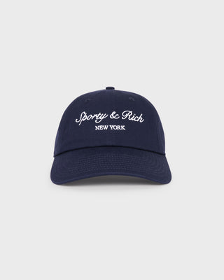 The Syracuse Hat - Dark Navy is a cotton twill dad hat featuring white Sporty & Rich New York embroidery on the front and an adjustable closure for a perfect fit.