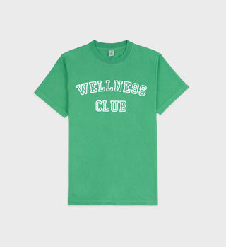 The Wellness Club T-Shirt - Verde/White is a unisex tee made from USA-grown cotton with WELLNESS CLUB in bold white collegiate letters on the front.