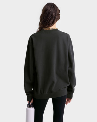 back view of model wearing faded black crewneck