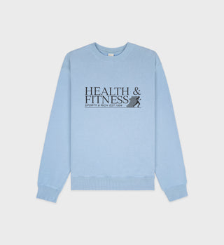 The Health & Fitness Crewneck - Sky Blue/Black features a front black print with HEALTH & FITNESS and a small figure. Made in the USA from 100% cotton for all-day comfort.