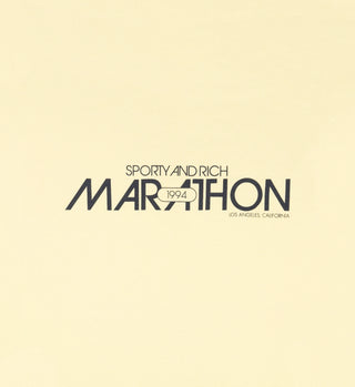 Text reads: Marathon Crewneck - Lemon, Marathon 1994, Los Angeles, California on a light background. Made in Los Angeles from USA-grown cotton.