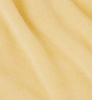 Close-up of the SR Tennis Terry Zip Hoodie in Almond/Pomodoro, showcasing its soft, textured cotton terry surface and gentle folds. Made in Portugal.