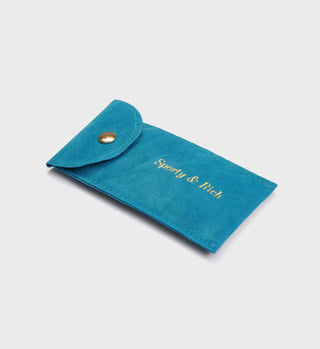 Turquoise suede pouch with a snap button and gold “Sweaty & Fresh” text—perfect for storing your Wellness Pearl/Bead Bracelet.