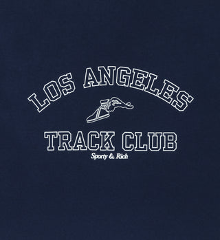 The Track Club Crewneck - Navy is a unisex shirt featuring Los Angeles Track Club Sporty & Rich text and a white winged shoe graphic, made from USA-grown cotton and proudly crafted in the USA.